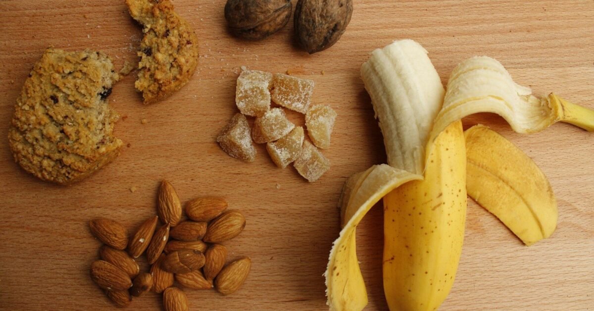 sliced banana and brown nuts on brown wooden table